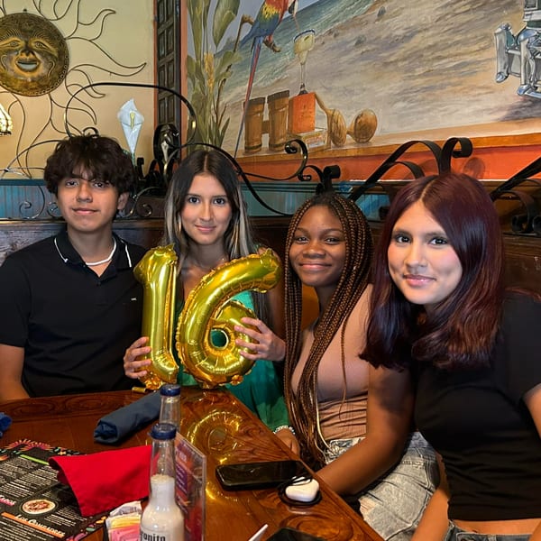 Four young people celebrating with a "16" balloon at a table in Chaparral Mexican Restaurant.
